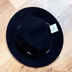 Black felt hat with silver detailing.